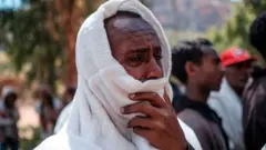 A man mourns in the village of Dengolat, North of Mekele, the capital of Tigray