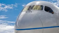 Close up of the nose of a Boeing 787 Dreamliner commercial jet airliner.