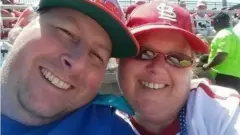 Man and woman at baseball game.