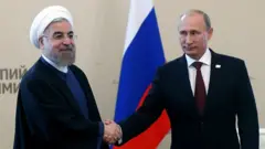 Hasan Rohani​ y Vladímir Putin.