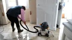 women cleaning the house