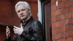 Julian Assange on a balcony at the Ecuador embassy