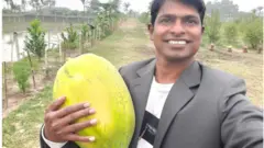জায়ান্ট পার্ল পেপে হাতে ডঃ নজরুল ইসলাম।