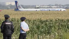 A Ural Airlines A-321 passenger plane is seen oon the site of its emergency landing in a field outside Zhukovsky airport in Ramensky district of Moscow region, Russia.