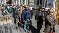 People queue to enter the Column Hall of the House of Unions to attend a memorial service for Mikhail Gorbachev, the last leader of the Soviet Union, in Moscow, Russia September 3, 2022