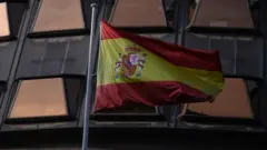 Spain's flag outside a court