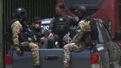 Venezuela special forces are seen outside the Tocoron prison after authorities seized control of the prison in Tocoron