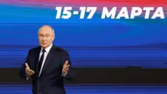 Russian President Vladimir Putin stands on stage at Gostiny Dvor in Moscow, Russia on 31 January 2024.