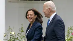 US VP Kamala Harris and President Joe Biden, unmasked, in the White House Rose Garden (13 May)