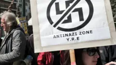 Anti-racist and anti-nazi activists gather outside the appeals court in Athens in 2013