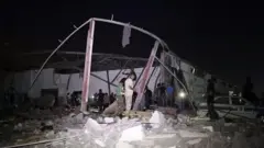 ထရစ်ပိုလီ မြို့စွန်က ရွှေ့ပြောင်းသူ ထိန်းသိမ်းရေး စခန်း တိုက်ခိုက်ခံရ