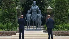 William and Harry stand in front of di statue