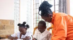 African mama dey help her son and daughter wit homework 