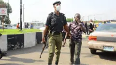 Police dey hold pesin for trouser