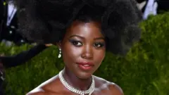 Lupita Nyong'o poses on the red carpet.