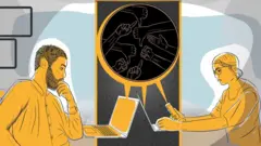 Two people looking at computers