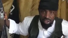 A screengrab taken on 24 March 2014 from a video obtained by AFP showing Boko Haram leader Abubakar Shekau