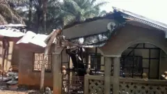One of di houses dem burn.