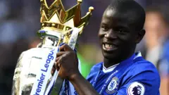 N'Golo Kante lifts the Premier League trophy