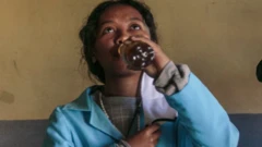 A student drinking Covid-Organics in Madagascar - April 2020