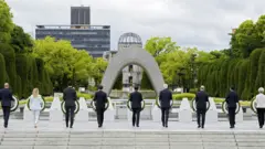 European Council President Charles Michel, Italian Prime Minister Giorgia Meloni, Canadian Prime Minister Justin Trudeau, French President Emmanuel Macron, Japanâ€™s Prime Minister Fumio Kishida, US President Joe Biden, German Chancellor Olaf Scholz, British Prime Minister Rishi Sunak, European Commission President Ursula von der Leyen lay flower wreaths at the Cenotaph for Atomic Bomb Victims in the Peace Memorial Park as part of the G7 Hiroshima Summit