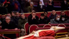 Former Pope Benedict XVI at his lying in state in the Vatican.