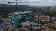 Cranes tower over the landscape as Nusantara is built
