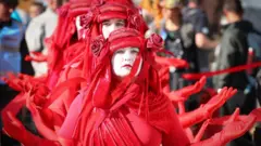 Activists dressed in red