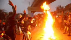 Manifestantes em Delhi