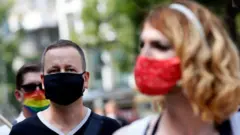 Berlin's senator for Culture and Europe, Klaus Lederer (L) takes part in a demonstration of artists calling for more financial support to face the crisis caused by the coronavirus pandemic, in Berlin, Germany, 09 August 2020.