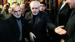 محمد جواد ظریف و حسین شریعتمداری