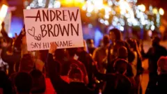 Image shows a protest over Mr Brown's death