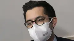 White House duty press secretary TJ Ducklo sits in the White House press briefing room on 9 February 2021