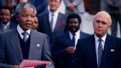 Nelson Mandela and FW de Klerk address a joint press conference