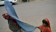 Woman and child in Kabul, August 31