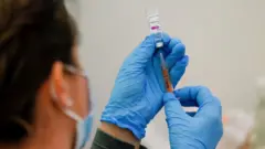 A dose of the AstraZeneca vaccine being prepared