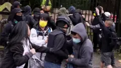 A still from a video shows a scuffle outside the consulate