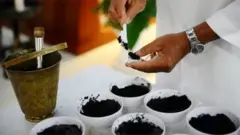 Priest administering Ash