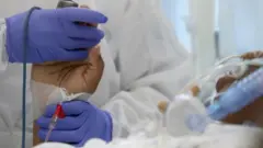 Brüksel'de tedavi edilen bir Covid-19 hastası