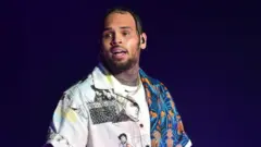 Di alleged victim tell police say Chris Brown hit her afta one argument