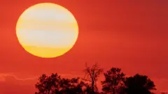 A picture of a blazing sun over California
