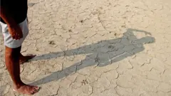 পানির অভাবে শুকিয়ে চৌচিড় আবাদি জমি।