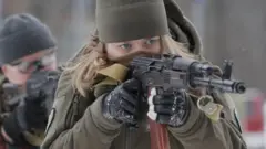 A Ukrainian military reservist trains near Kyiv