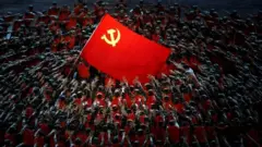 Performers rally around the Red Flag during a show commemorating the 100th anniversary of the founding of the Communist Party of China at the National Stadium in Beijing, China June 28, 2021