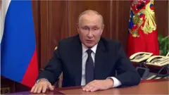 путін