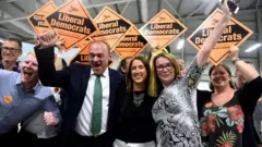 Liberal Democrats candidate Jane Dodds reacts after winning the by-election for the district of Brecon and Radnorshire at the Royal Welsh Showground