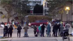Footage showing a car about to hit a parade in Waukesha, Wisconsin