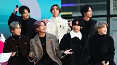 BTS pose on stage