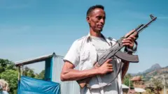 Amhara militia man with weapon