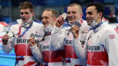 Great Britain's swimmers with their medals